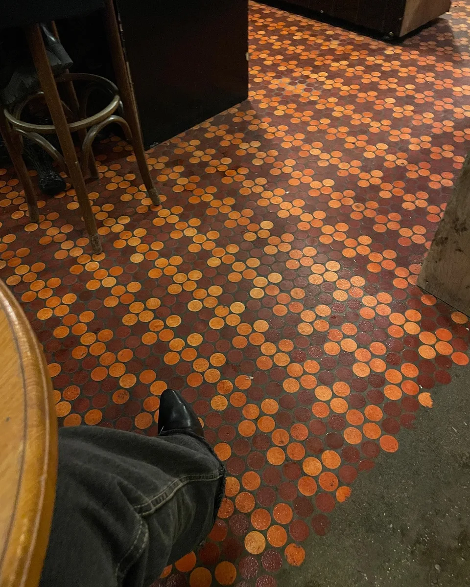Penny-tiled floor at Le Barav, Paris